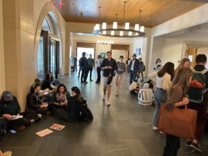 Students engage in a sit-in protest in Wasserstein Hall to advocate for more reproductive justice academic offerings at HLS.