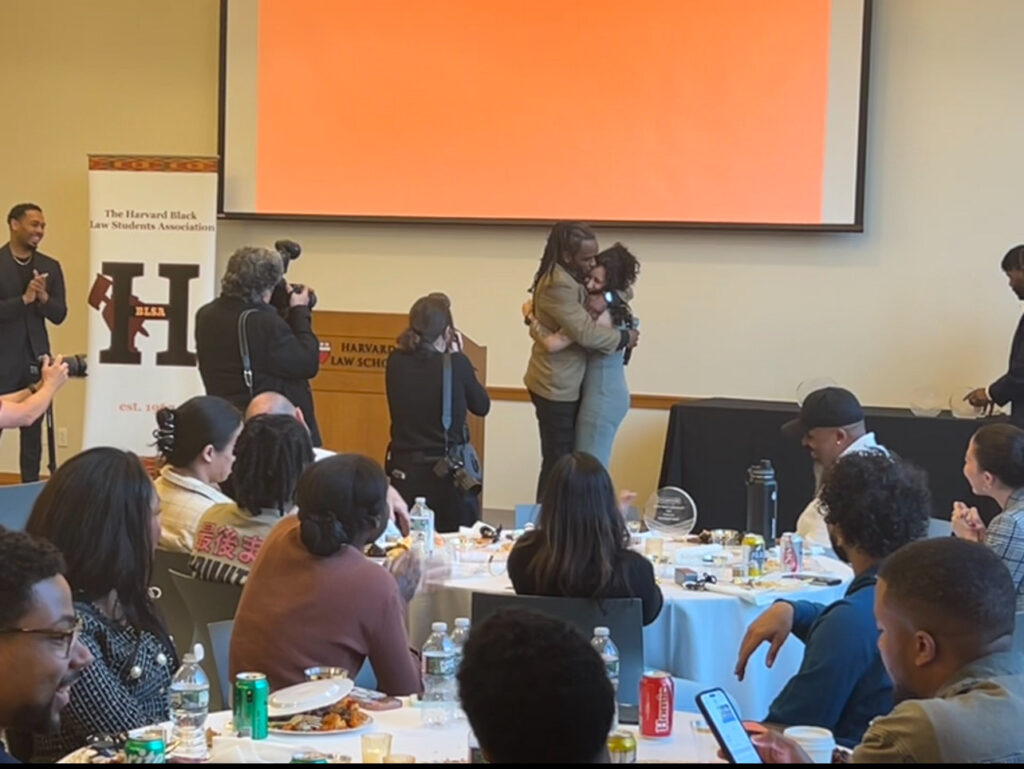 Brione Merchant embraces Clarah Letito after announcing her award win.