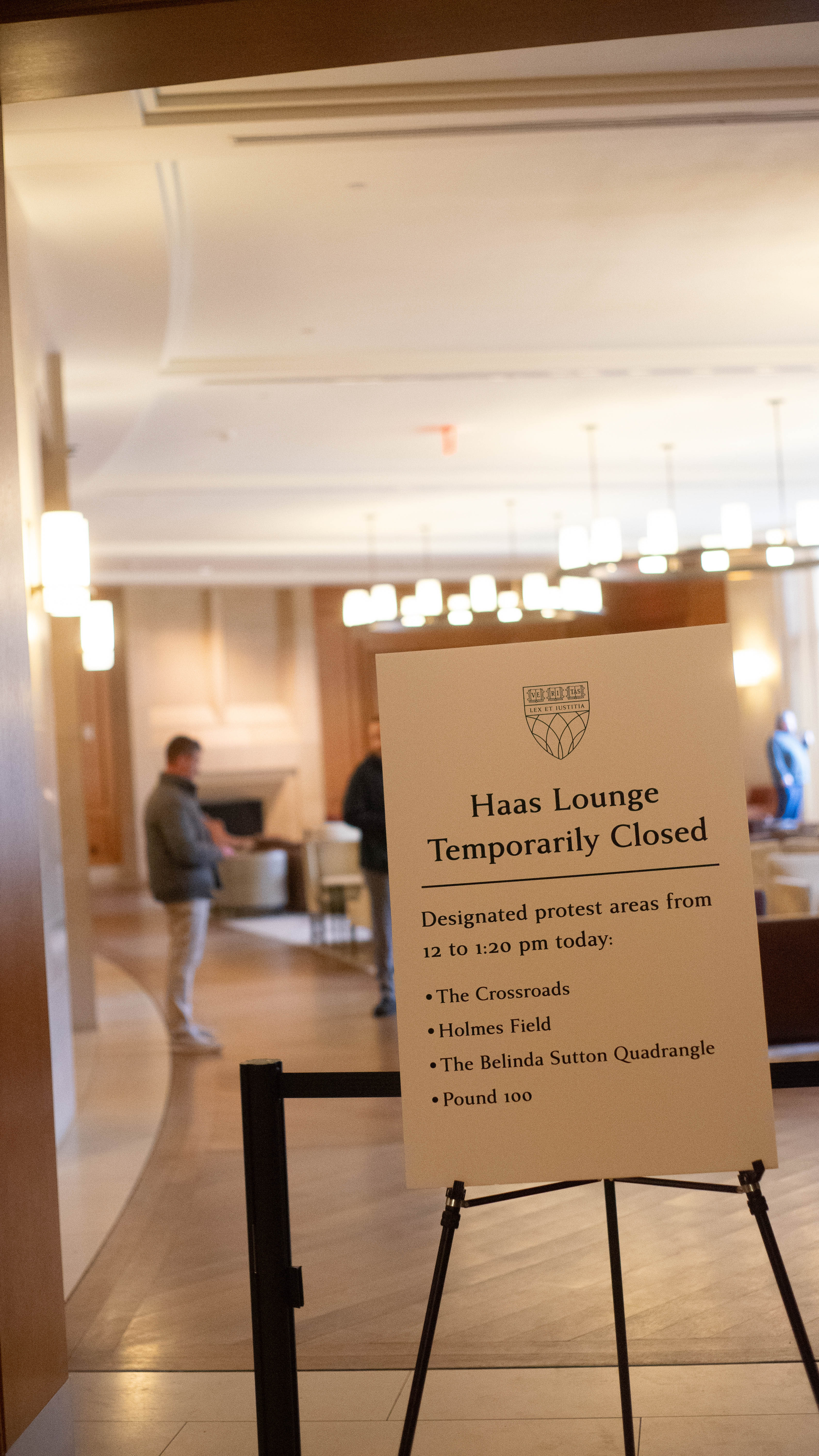 Photograph of Haas Lounge closed, with a sign posted explaining the closure. 
